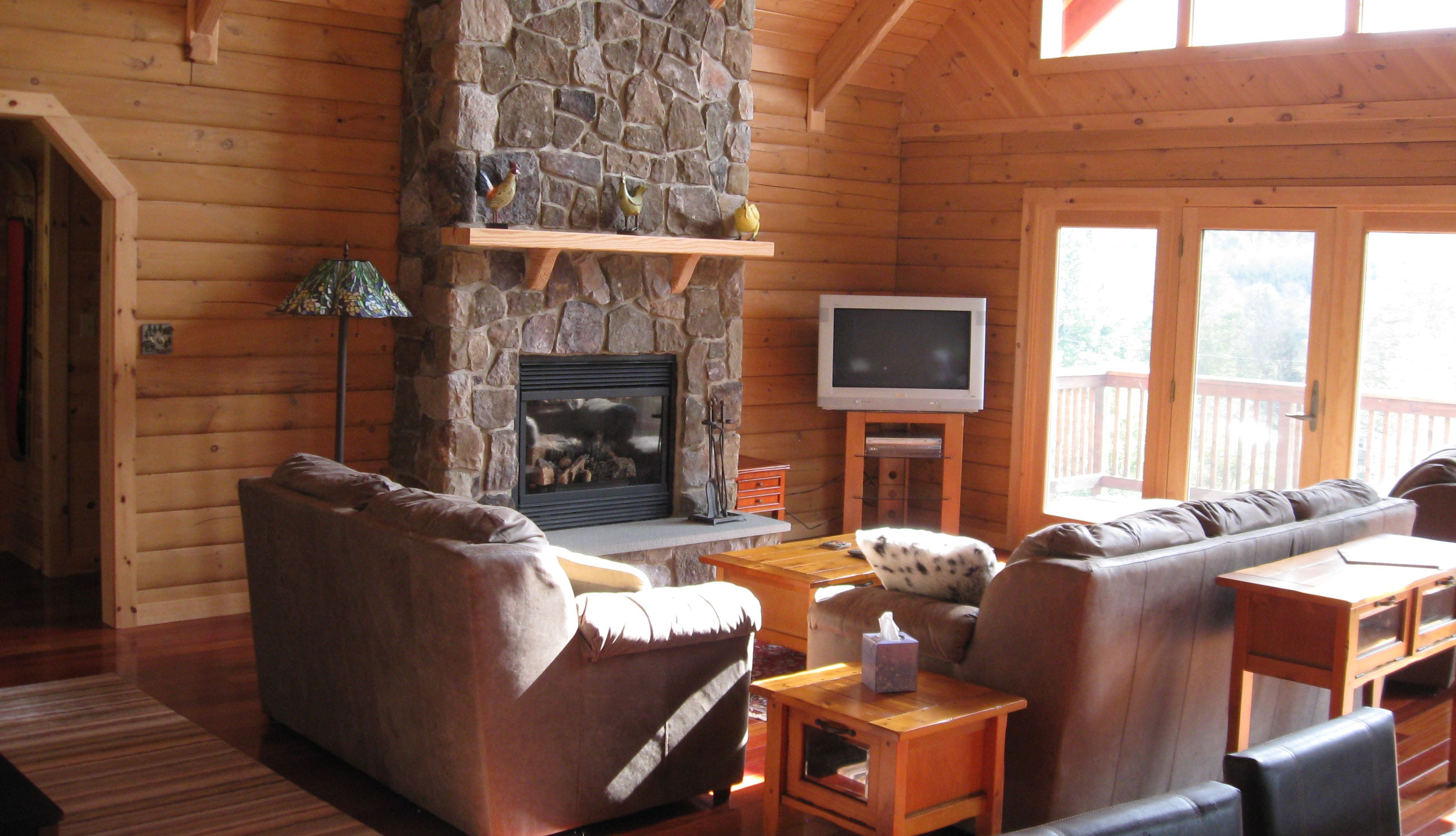 Comfy living room with French Doors to deck. Gas fireplace and TV.